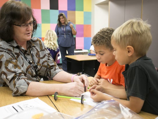 Science and math teacher Sheri Pierce works with Jace