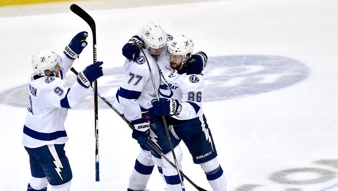 Tampa Bay Lightning right wing Nikita Kucherov (86) and Victor Hedman (77) and Tyler Johnson celebrate after a goal by against the Pittsburgh Penguins during the third period in game five of the Eastern Conference Final of the 2016 Stanley Cup Playoffs at Consol Energy Center.