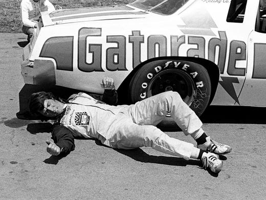 Darrell Waltrip checks his car out after a practice
