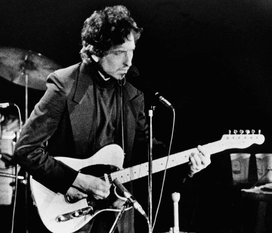 In this Jan. 29, 1974, file photo, singer and poet Bob Dylan performs at the Nassau Coliseum, in Uniondale, New York.