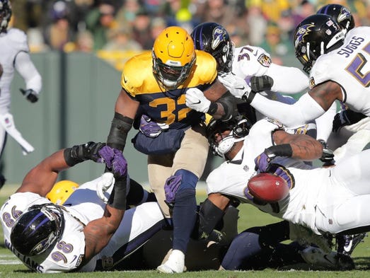 Green Bay Packers running back Devante Mays fumbles