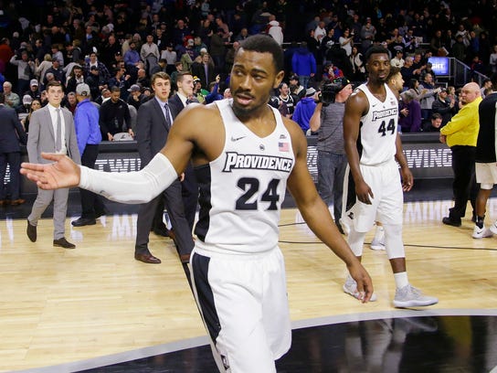 Providence guard Kyron Cartwright (24) acknowledges the crowd as he walks off the court after an NCAA college basketball game against Xavier, Saturday, Jan. 6, 2018, in Providence, R.I. Providence upset Xavier 81-72 . (AP Photo/Stephan Savoia)
