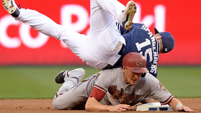 June 27, 2015; San Diego; San Diego Padres second baseman Cory Spangenberg (top) has his legs taken out from under him by Arizona Diamondbacks shortstop Nick Ahmed during a double play during the first inning at Petco Park.