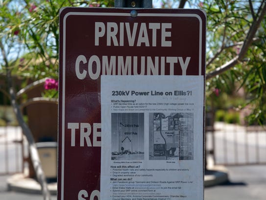 A sign about the proposed power line routes taped to