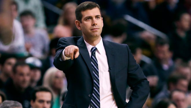 Boston Celtics head coach Brad Stevens calls to his players during the first quarter of a first-round NBA playoff basketball game against the Cleveland Cavaliers in Boston, Thursday, April 23, 2015.