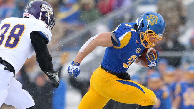 SDSU senior Zach Zenner (right) is a candidate for the Walter Payton Award, given to the top offensive player in the FCS.