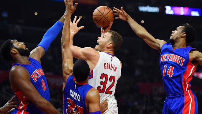Clippers forward Blake Griffin, second from right, shoots as Pistons center Andre Drummond, left, forward Tobias Harris, second from left, and guard Ish Smith defend during the first half Monday in Los Angeles.