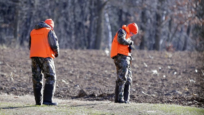 On the opening weekend of gun deer season, Brian Argo and his daughter, Katie, head back out after a brief break from hunting Sunday, November 20, 2016, near Shiocton, Wisconsin.