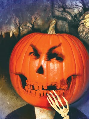 
Illustration of a scary pumpkin with a haunted house in the background. 
