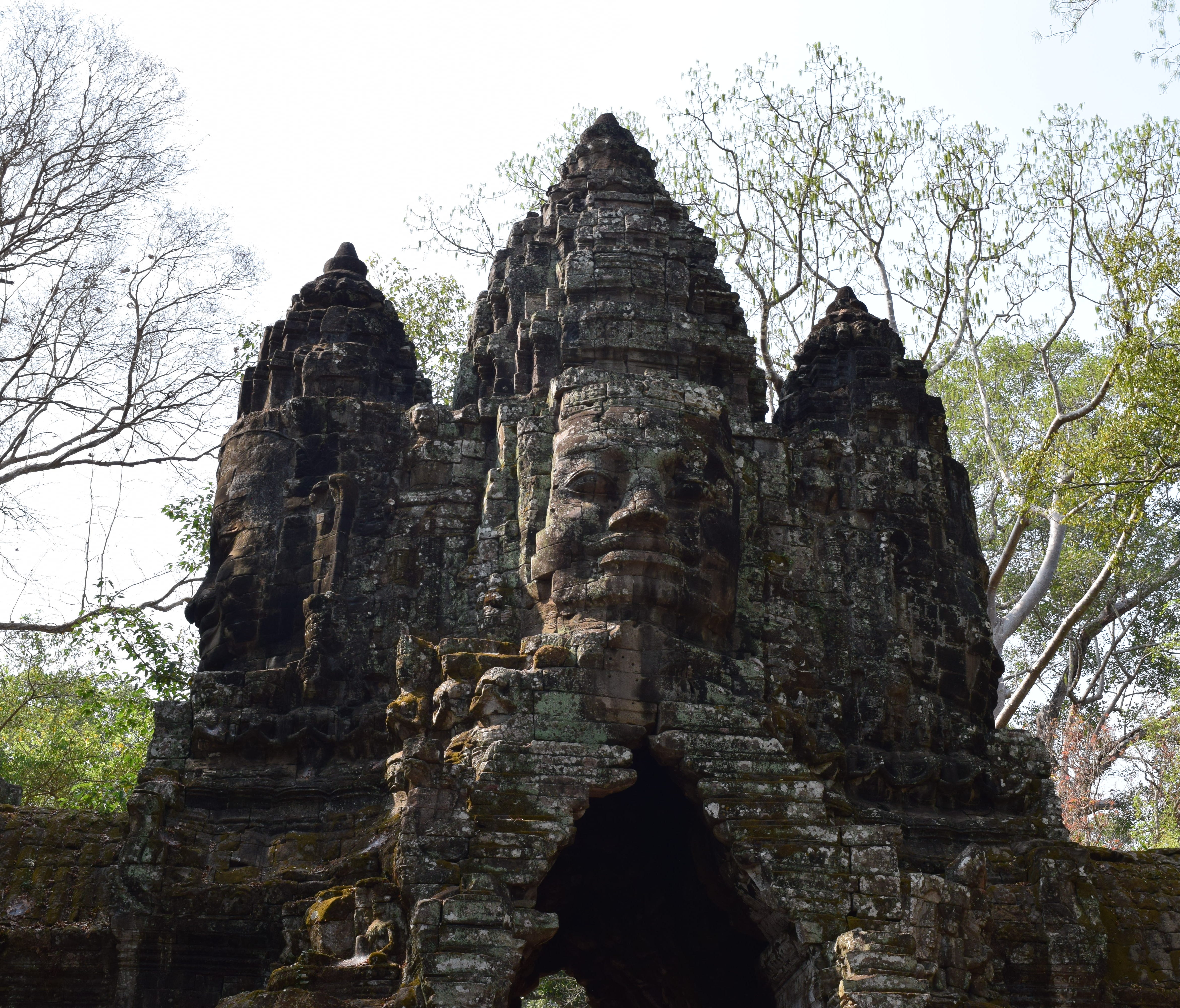 The trademark of Angkor Thom is its four-sided structures with faces looking in every direction. In addition to the five gate towers (this is the North Gate), there are 49 more four-faced towers in the interior temple, for a total of 216 faces.