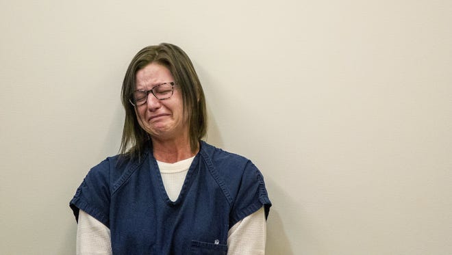 Kristina Ryl reacts as she listens to victim impact statement during her sentencing at the Kent County Courthouse in Grand Rapids, Mich., on Monday, March 19, 2018. Ryl, who hit an elderly couple walking their dogs in August in western Michigan, killing one of them and one of their dogs, has been sentenced to at least two years in prison. Charges included operating while intoxicated causing death and operating while intoxicated causing serious injury.