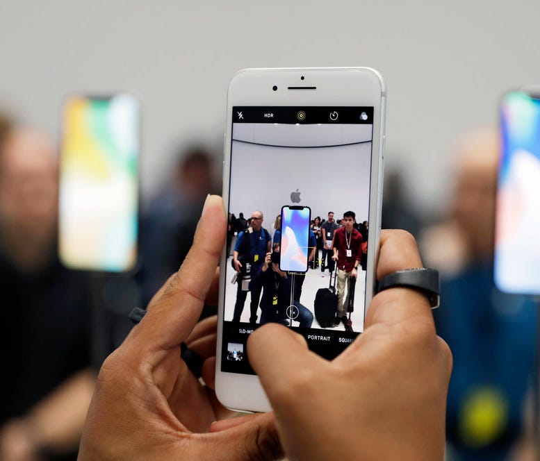 The new iPhone 8 Plus is displayed in the showroom after the new product announcement at the Steve Jobs Theater in Cupertino, Calif. Some iPhone users are reporting big drains on battery life with the new iOS 11 upgrade.