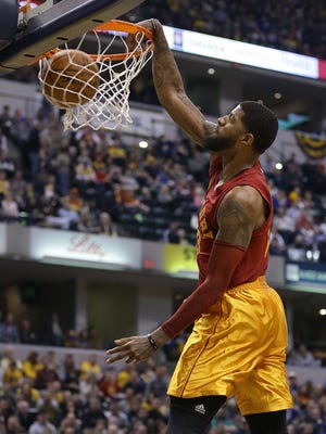 Indiana Pacers forward Paul George (13) slams down two points in the first half of their game Wednesday, April 6, 2016, evening at Bankers Life Fieldhouse.
