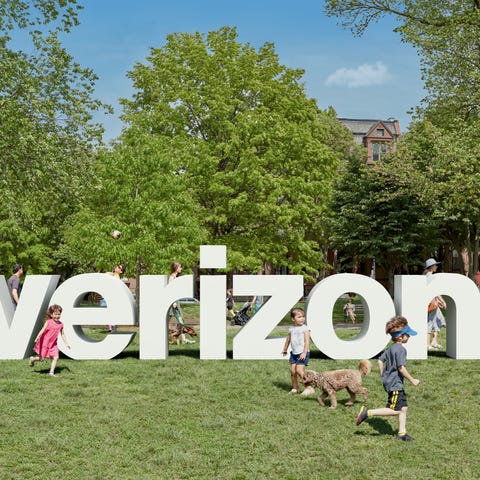 A 3D rendering of Verizon's logo placed in a park.