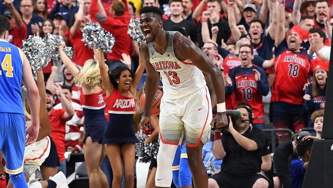 Mar 9, 2018; Las Vegas, NV, USA; Arizona Wildcats forward Deandre Ayton (13) celebrates after scoring against the UCLA Bruins in a Pac-12 Tournament semi-final at T-Mobile Arena. Mandatory Credit: Stephen R. Sylvanie-USA TODAY Sports