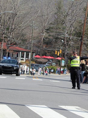 A large crowd gathered in downtown Black Mountain to say goodbye to the Rev. Billy Graham, who passed away at his Montreat home on Feb. 21. Graham's funeral procession, which took him to Charlotte, exited I-40 and made its way east on U.S. 70 through the center of town, just miles from his former home.