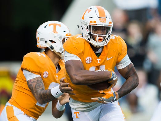 Tennessee running back John Kelly (4) runs with the
