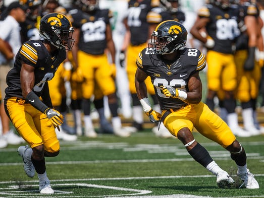 Iowa's Matt Quarells (83) warms up before taking on