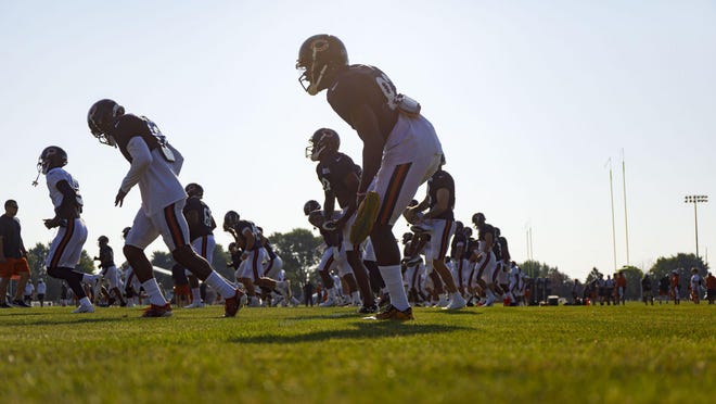 The Chicago Bears warm up during training camp on July 28, 2019.