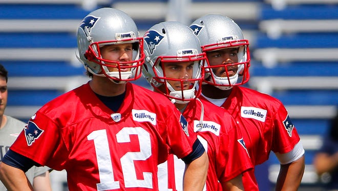 Patriots QB Tom Brady (12) may soon have to give way to backup Jimmy Garoppolo (10).