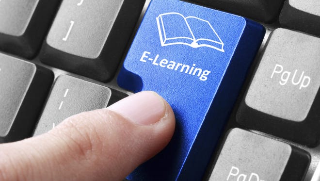 Stock photo: E-learning button on the keyboard