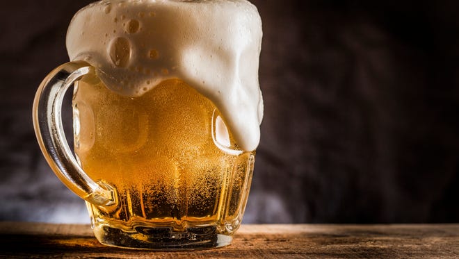 Scientists say that the bubbles in beer make it less likely that you'll spill your Coors than a cup of joe.