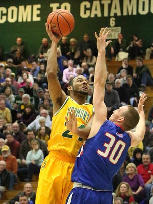 UVM’s Dre Wills tosses in two points during the first half of Vermont's game vs. UMass-Lowell. The Cats lost 92-83.