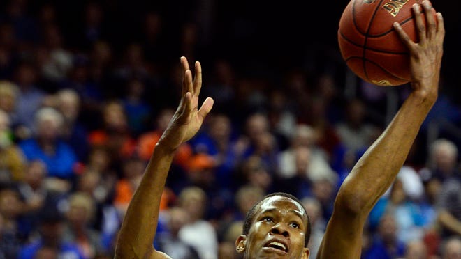 Duke forward Rodney Hood (5) takes a shot against the Virginia Cavaliers in the championship game of the ACC college basketball tournament at Greensboro Coliseum. Mandatory Credit: John David Mercer-USA TODAY Sports