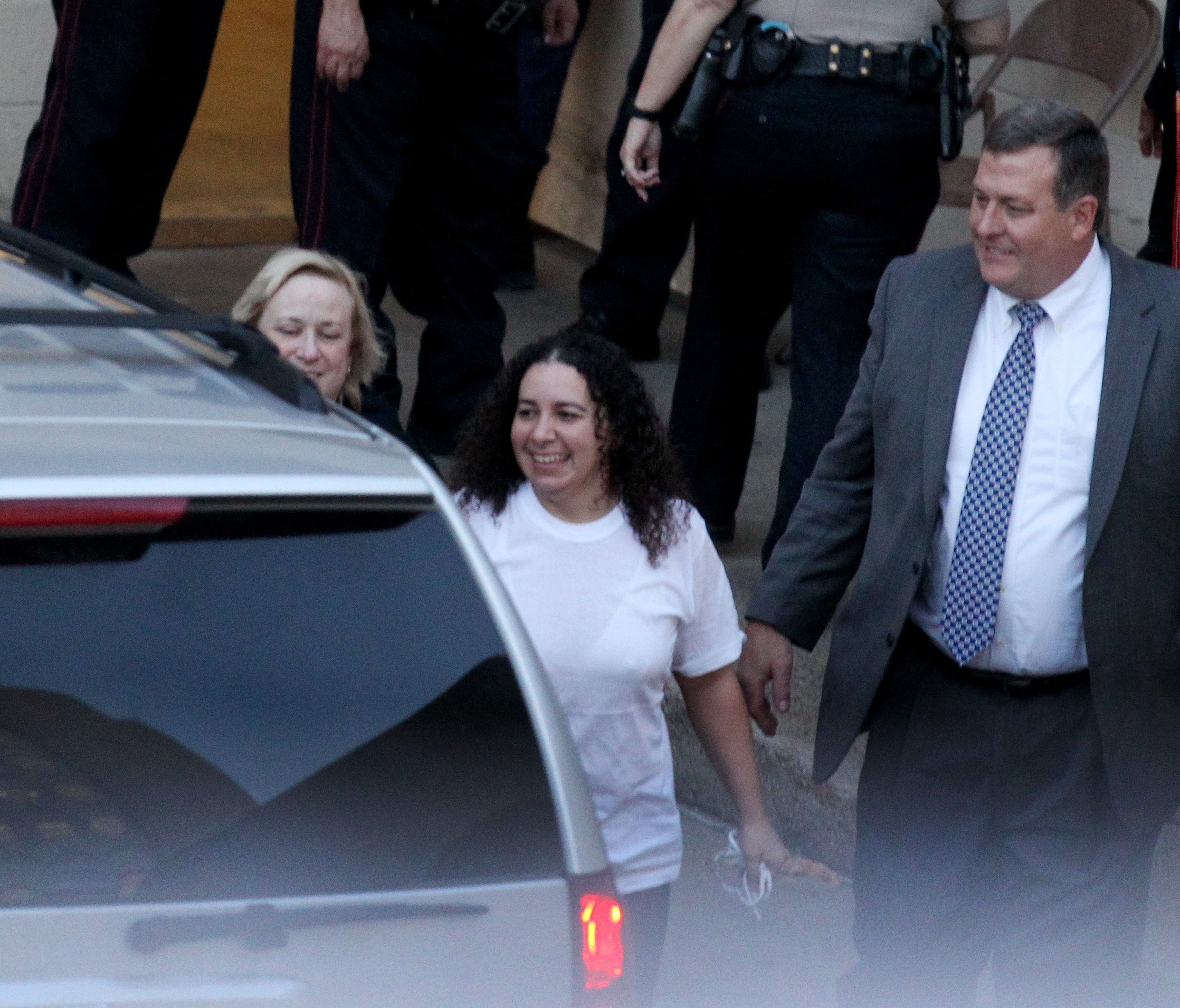 Caller-Times file photo  Hannah Overton (center) smiles as attorneys Cynthia Orr (left) and John Raley (right) escort Overton out of the Nueces County Jail Tuesday, Dec. 16, 2015 following a bail hearing at the Nueces County Courthouse in Corpus Chris