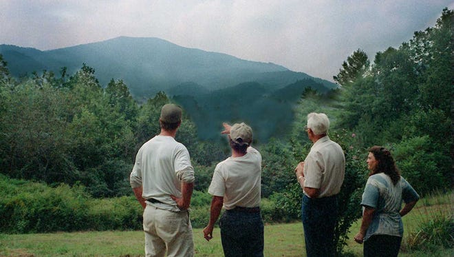 8/29/96 - (l-r) Pete Dixon, Rob Kelly, Floyd Waldroup, and Mary Kelly, who were opposed to the Bluff Mountain cut, discuss the changes that will take place if the mountain is opened for logging.