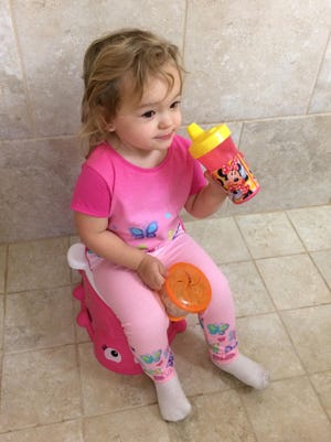 Isabella hasn’t quite figured out the potty just yet. It’s certainly not for use as a seat while eating Cheerios and drinking water.