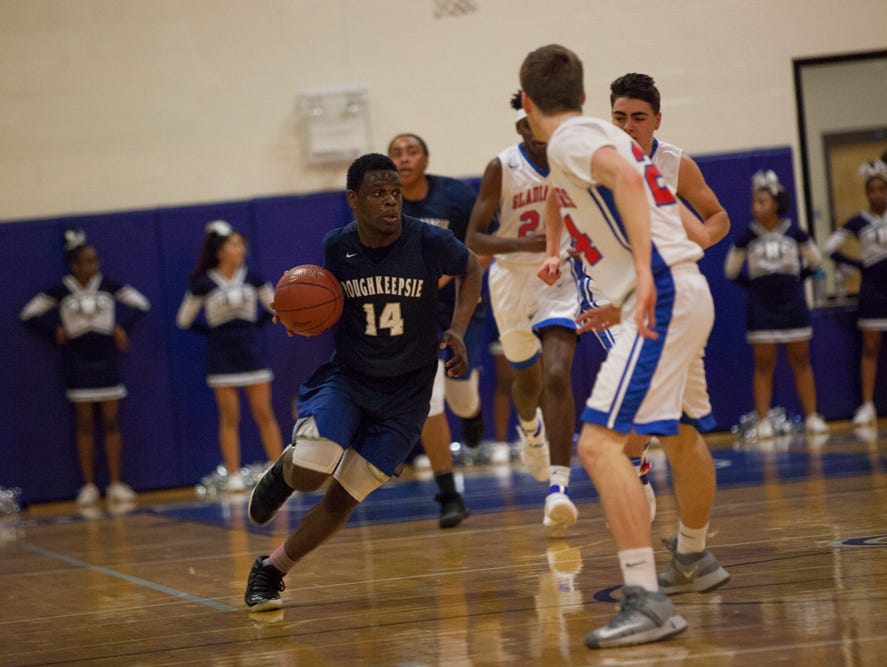 Poughkeepsie's Tremell Reaves drives against the Goshen defense during the Section 9 Class A final on March 5.