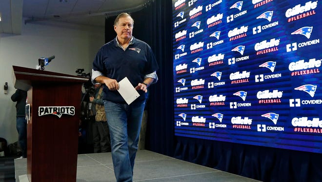New England Patriots head coach Bill Belichick walks from the podium after a news conference prior to a team practice in Foxborough, Mass., Thursday, Jan. 22, 2015. Belichick addressed the issue of the NFL investigation into deflated footballs.