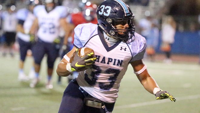 Chapin senior Brannon Bullitt, 33, catches a short pass before sprinting to the end zone for the Huskies' first score of the night against the Irvin Rockets on Friday night at Irvin. Chapin won, 41-13.