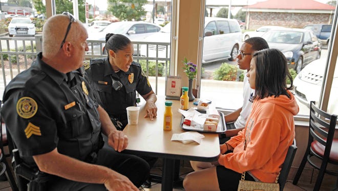 Officers met with several citizens during Coffee with a Cop on Saturday morning at Chik-fil-A on Wilma Rudolph Boulevard in Clarksville.
