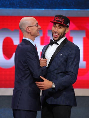 Denzel Valentine greets NBA commissioner Adam Silver after being selected by the Chicago Bulls as the No. 14 overall pick in Thursday's NBA Draft.
