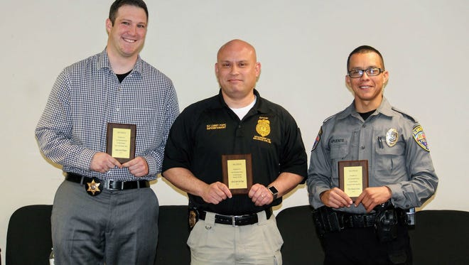 The New Mexico Children, Youth and Families Department (CYFD) recognized five law enforcement officers Tuesday at Kids Inc., 1108 Cuba Ave., in their efforts of protecting and serving children. From left to right, Otero County Sheriff’s Office Deputy Garrett Wimsatt, Special Agent Larry Pope with Special Forces at Holloman Air Force Base and Alamogordo Police Department officer Mauricio Puente.
