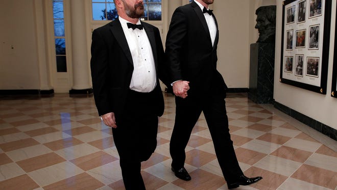 Andrew Sullivan of The Dish, left, and Aaron Tone arrive at the White House for a State Dinner for British Prime Minister David Cameron and his wife, Samantha, on March 14, 2012.