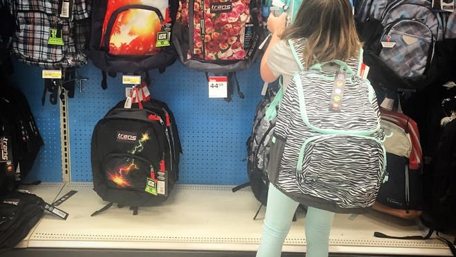 New backpack, big decision. Sophie Stern, 13, waits all summer for this moment.