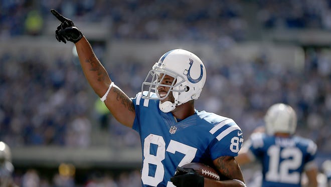 Indianapolis Colts Reggie Wayne celebrates his touchdown in the second half. The Indianapolis Colts played the Tennessee Titans Sunday. September 28, 2014, afternoon at Lucas Oil Stadium.