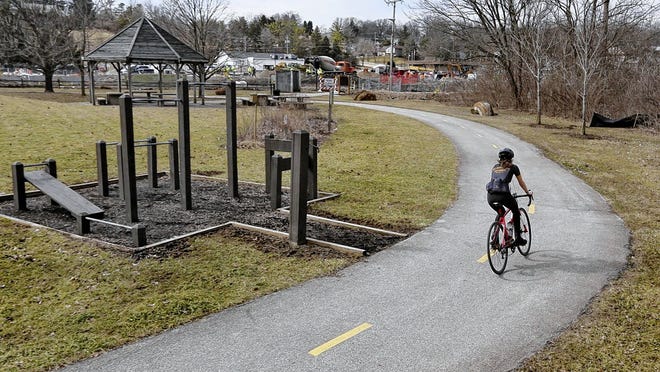 A cyclist makes a loop around the northern end of the Olentangy Trail at Worthington Hills Park last year. One goal of the five-year-old Olentangy Powell and Liberty Trails group is to connect the city and township trail systems to the Olentangy Trail.