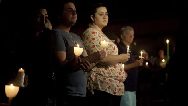 Images from the candlelight vigil held at TattleTails nightclub June 12, 2016 in Port St. Lucie. The vigil was in honor of those who were killed at Pulse, a gay nightclub in Orlando.