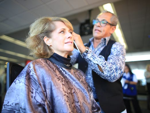A United Airlines flight attendant has her hair done