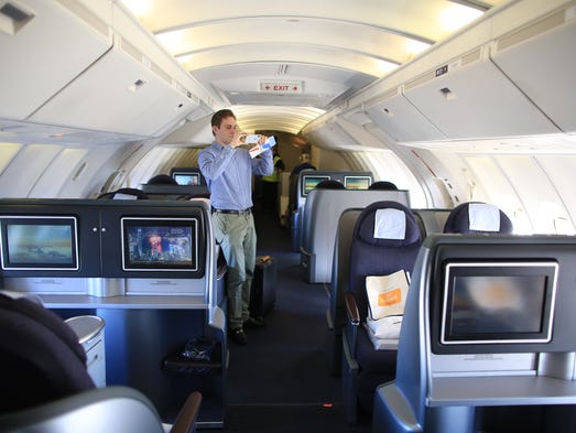 A passenger aboad the iconic upper deck of United
