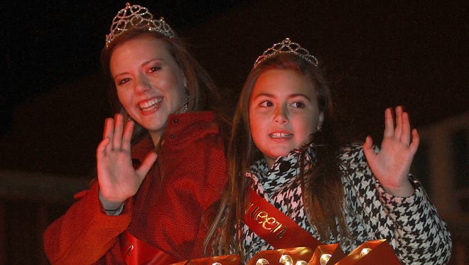 Holi-Fest Queens Bailey Thomton left, and Alley Hibdon  ride in the Portland Christmas parade in 2015.