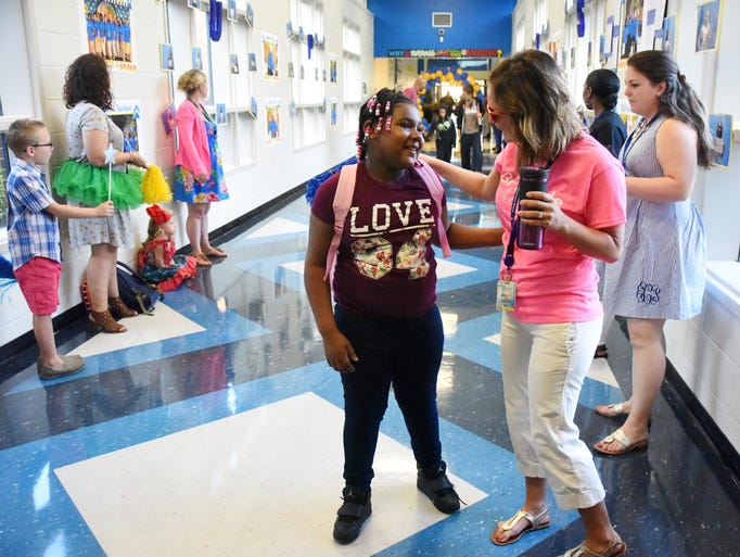 Faculty and staff at Welcome Elementary School greeted