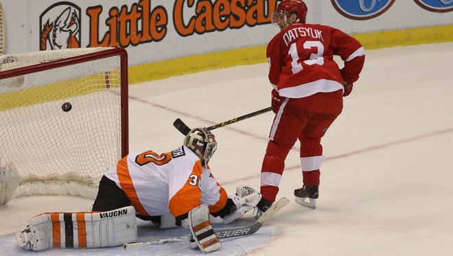 Red Wings forward Pavel Datsyuk scores during the shoot-out against Flyers goalie Michal Neuvirth Sunday at Joe Louis Arena.