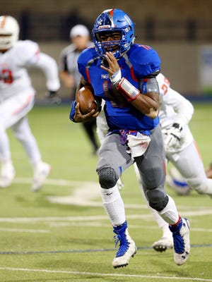 Americas' Joshua Allen moves the ball up the field Friday night during a Class 6A Division II Region I area playoff game against San Angelo Central at Grande Communications Stadium in Midland.