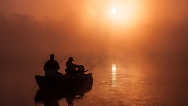 "Foggy Sunrise on Eagle Lake," by Steve Nowakowski of Lambertville, catches fishermen at dawn at Fort Custer State Park in Battle Creek.