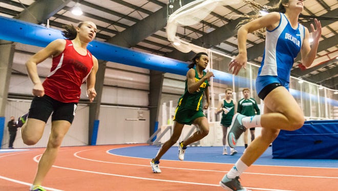 Runners round the corner during a 300m heat during the Bayside Indoor Track Championships at the Worcester County Recreation Center on Wednesday, Jan 20 in Snow Hill.